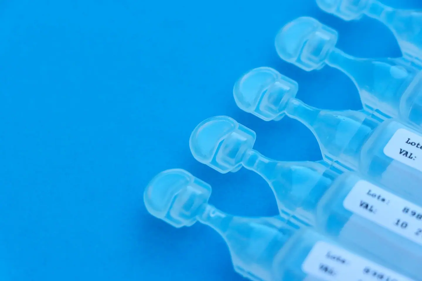 A strip of single-dose plastic vials with twist-off tops