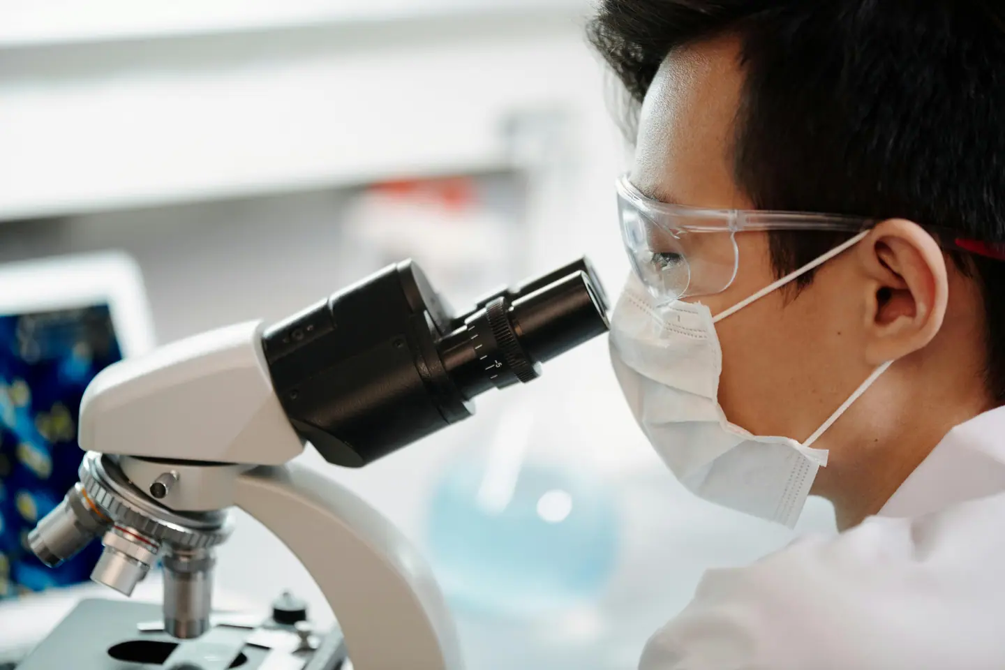 Scientist at a microscope